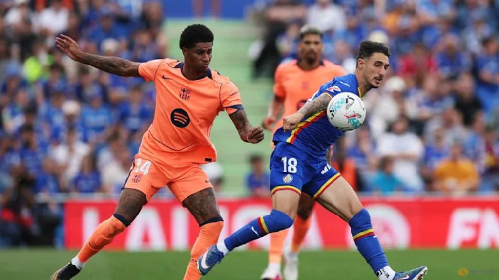 Barcelona march on towards title with 2-0 victory at Getafe